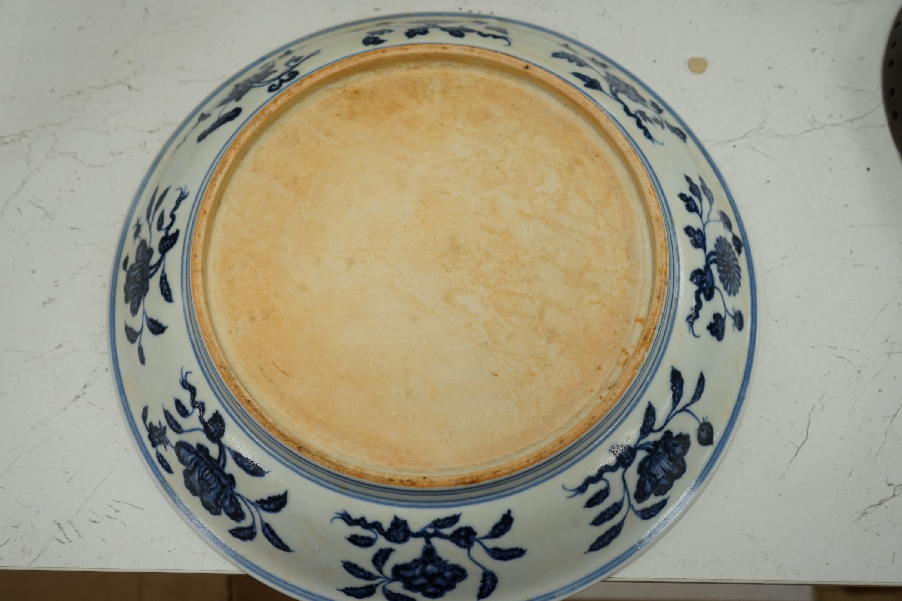 A Chinese blue and white pomegranate dish, 33cm diameter, Condition - firing crack to surface of dish